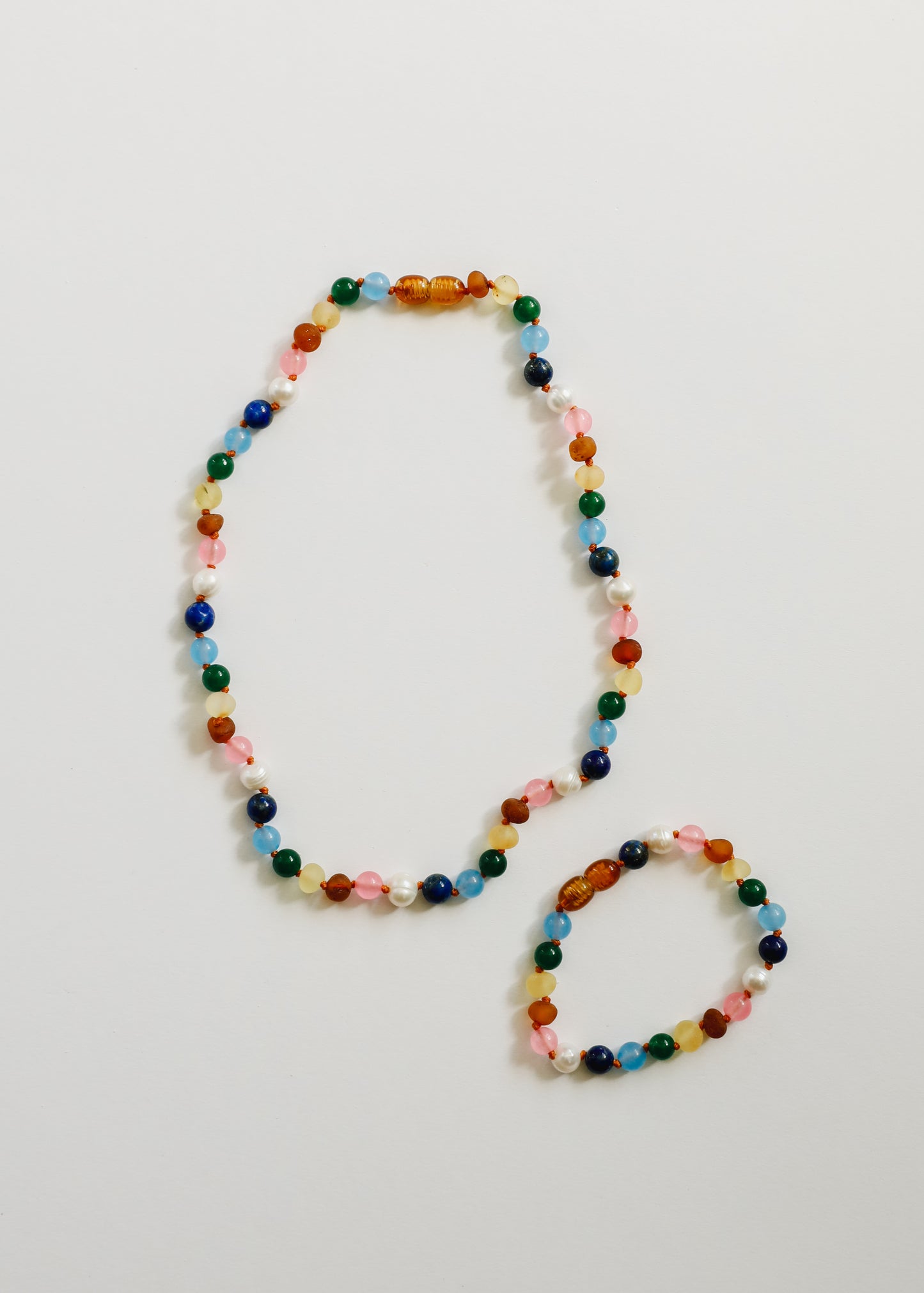 Pulsera de perlas y ámbar báltico crudo + piedras preciosas de color rosa dulce